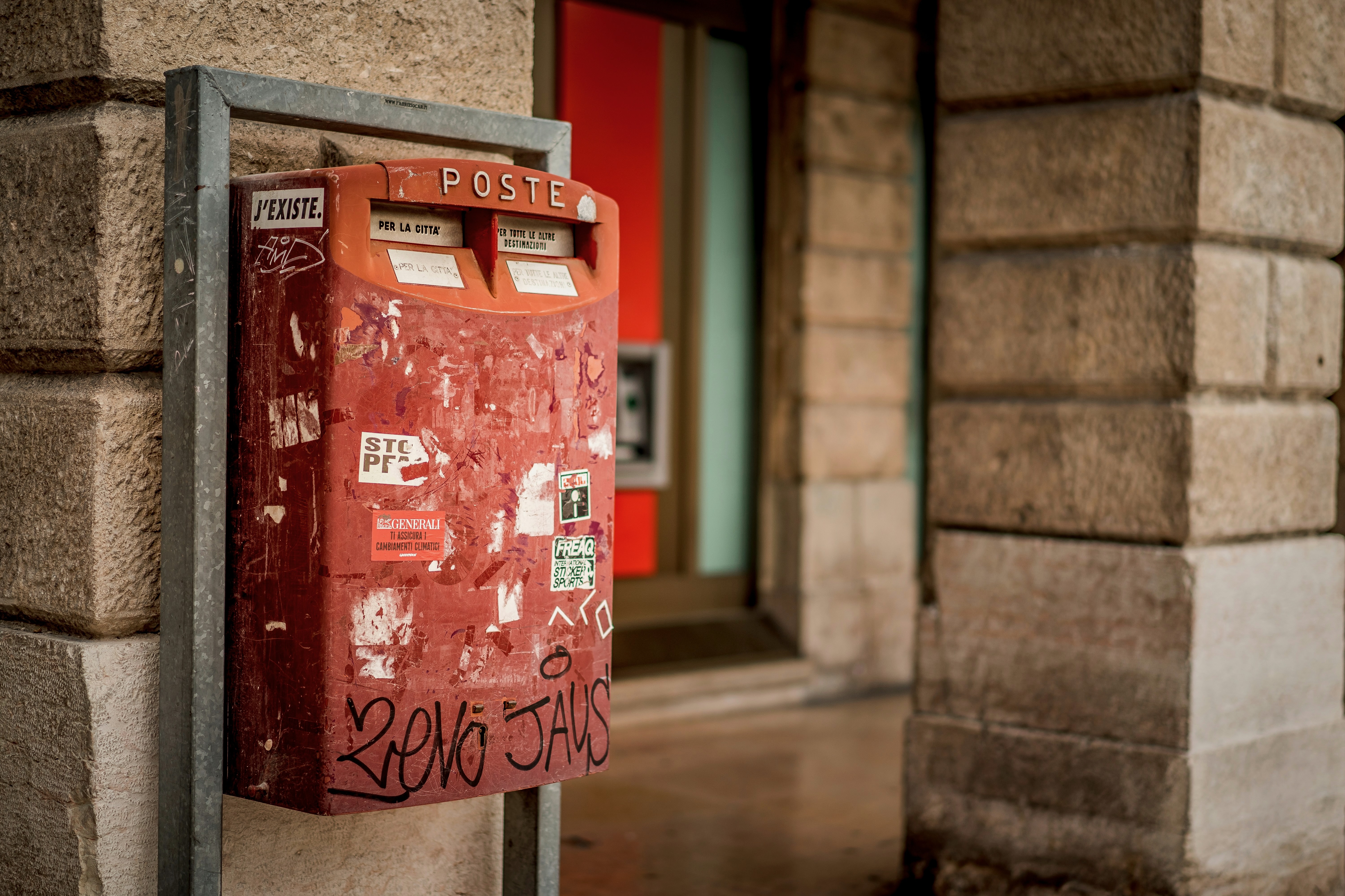 red mailbox on wall
